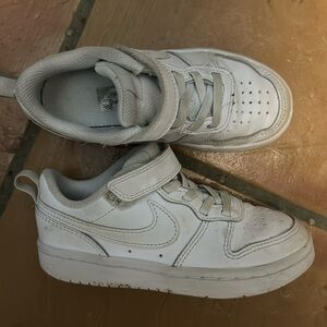 Kids white Nike sneakers